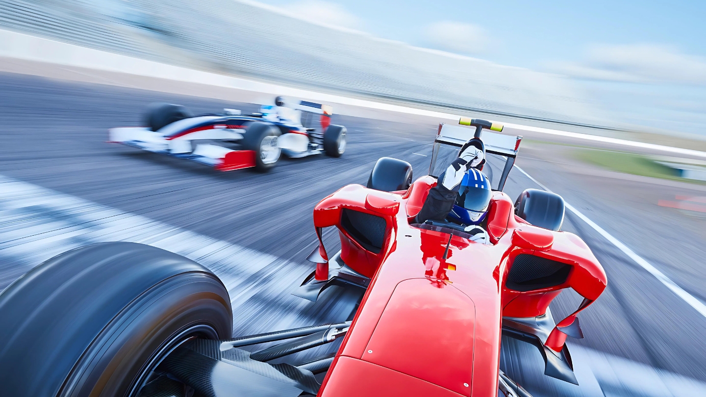 Close-up of a red Formula 1 car crossing the finish line during a high-speed race on the track.