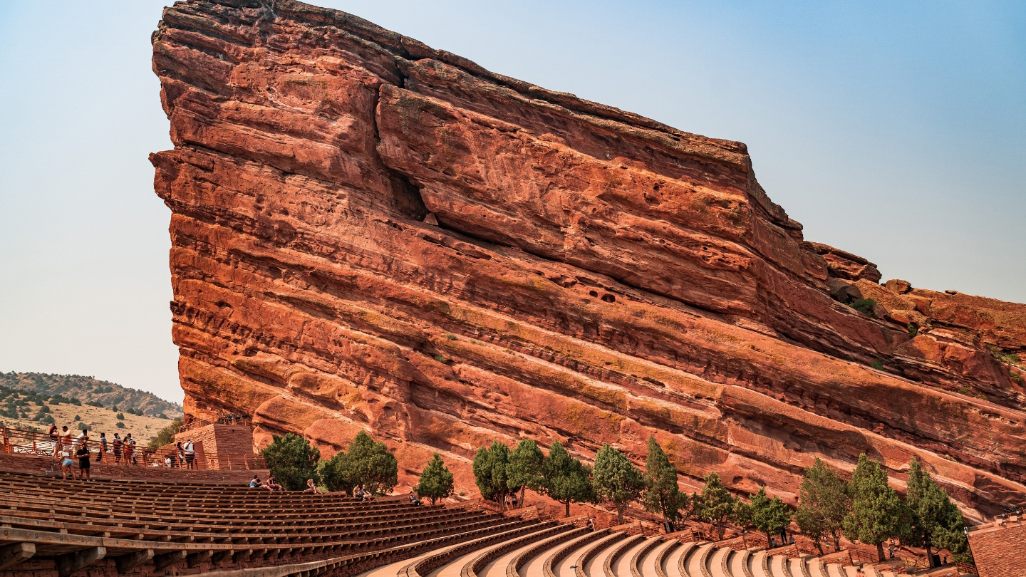 Close-up view of the towering red rock formations and seating area of the historic Red Rocks Amphitheatre.