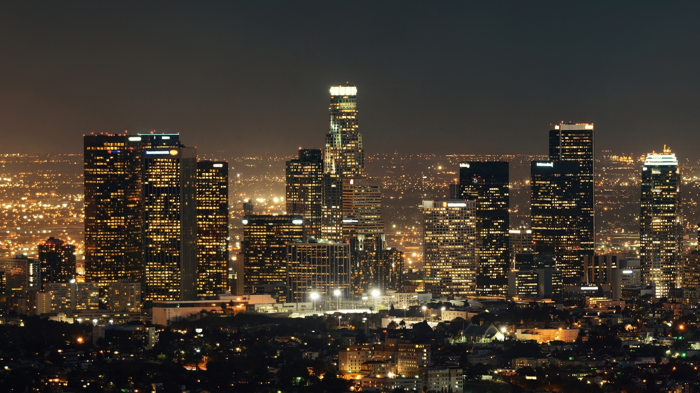 Stunning night view of the illuminated Los Angeles skyline, highlighting the vibrant cityscape.