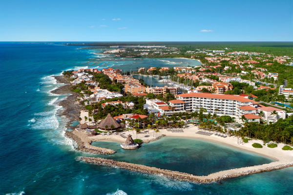 Luxurious beachfront resort with stunning ocean views, lush tropical landscaping, and serene private beaches, offering the ultimate Caribbean getaway.