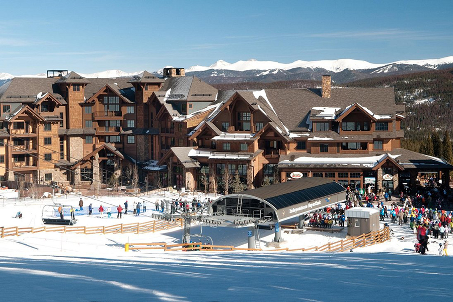 Lively ski area with skiers at Grand Lodge on Peak 7 near Independence SuperChair in Breckenridge, Colorado.