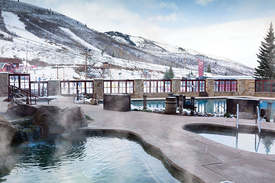 Steamy outdoor hot tub at Marriott’s Mountainside, surrounded by snowy mountain views.