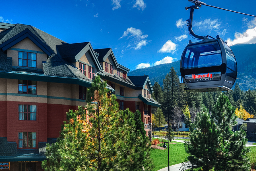 Marriott’s Timber Lodge in South Lake Tahoe, located next to the Heavenly Gondola, with mountain views and pine trees.