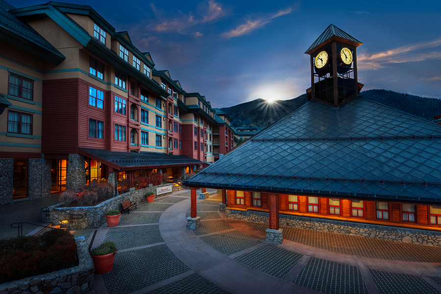 Marriott’s Timber Lodge entrance and clock tower at dusk, located in Heavenly Village, South Lake Tahoe.