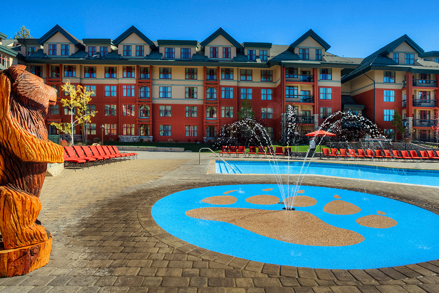 Children’s splash pad and outdoor pool at Marriott’s Timber Lodge, featuring bear-themed decorations in Lake Tahoe.